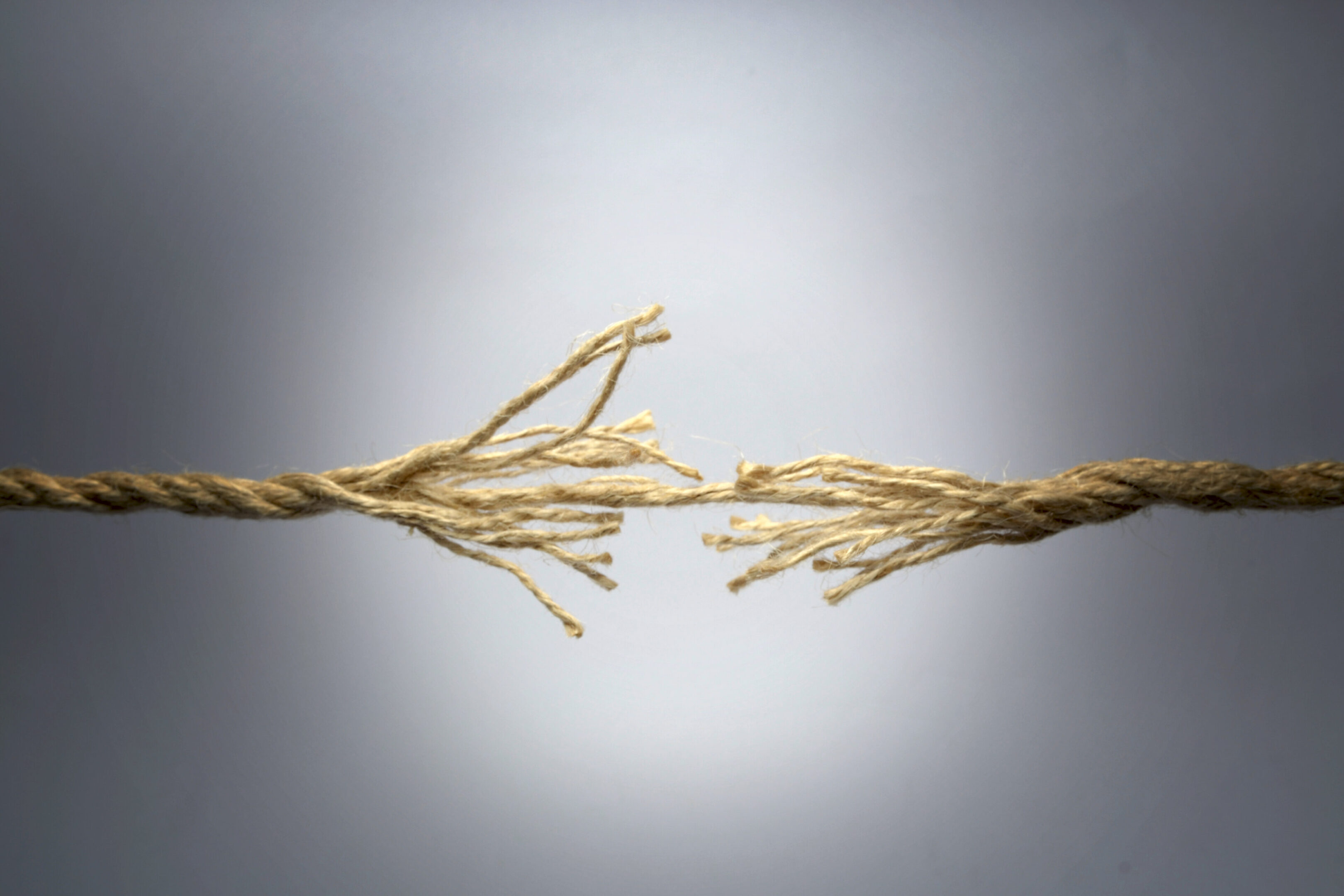 Broken Rope Broken rope on dark background.
